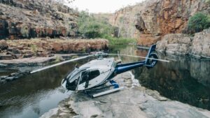 True-North_The-Kimberley_Helicopter_Creek-Landing-scaled